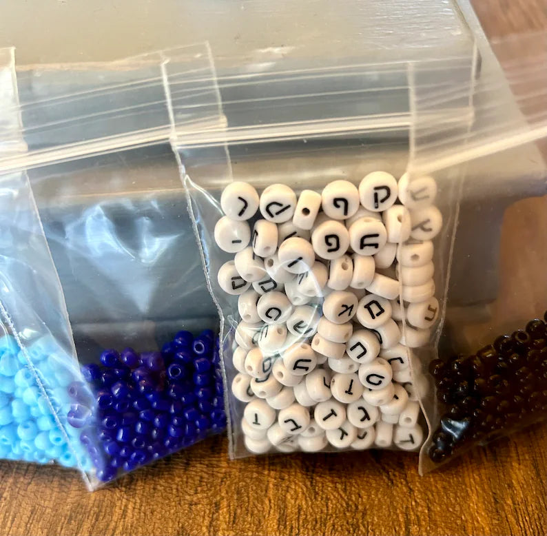 Large Hebrew letter bracelet making kit by Pretty Beans featuring blue beads and supplies for DIY jewelry creation.