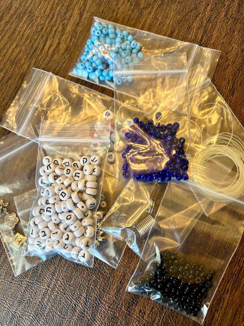 Large Hebrew letter bracelet making kit by Pretty Beans featuring blue beads and supplies for DIY jewelry creation.
