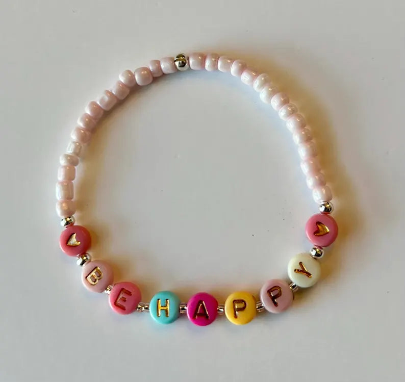 DIY jewelry kit by Pretty Beans with seed beads, alphabet beads, and silver plated charms for bracelet making.