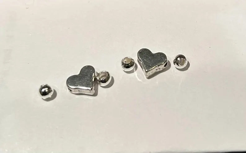 Purple Hebrew letter beads with hearts and silver-plated spacers, 7mm size, from Pretty Beans, ideal for jewelry making.