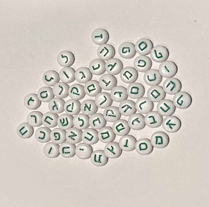 Green Hebrew alphabet beads for DIY jewelry making, featuring colorful letter designs on small round beads by Pretty Beans.