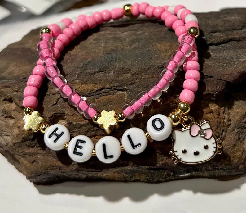 DIY Hello Kitty stretch bracelet making kit by Pretty Beans with colorful beads and charms for jewelry crafting.