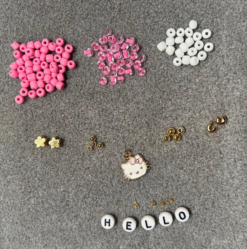 DIY Hello Kitty stretch bracelet making kit by Pretty Beans featuring colorful beads and elastic cord for jewelry crafting.