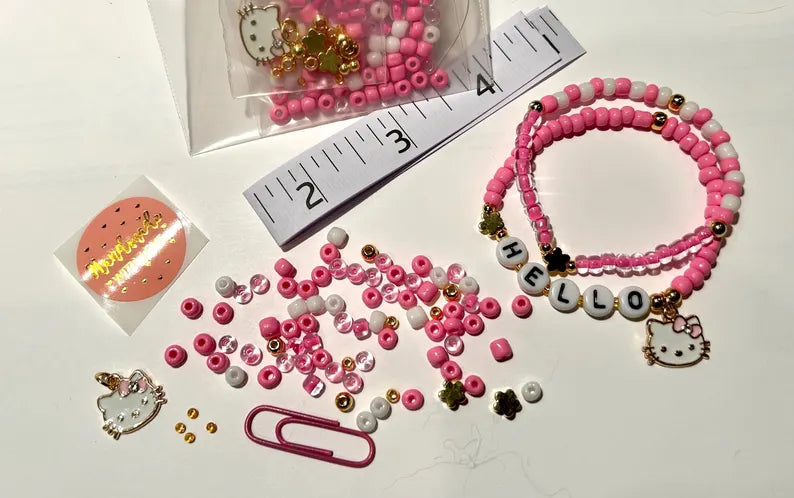 DIY Hello Kitty stretch bracelet making kit by Pretty Beans, featuring colorful beads and jewelry supplies for crafting fun accessories.