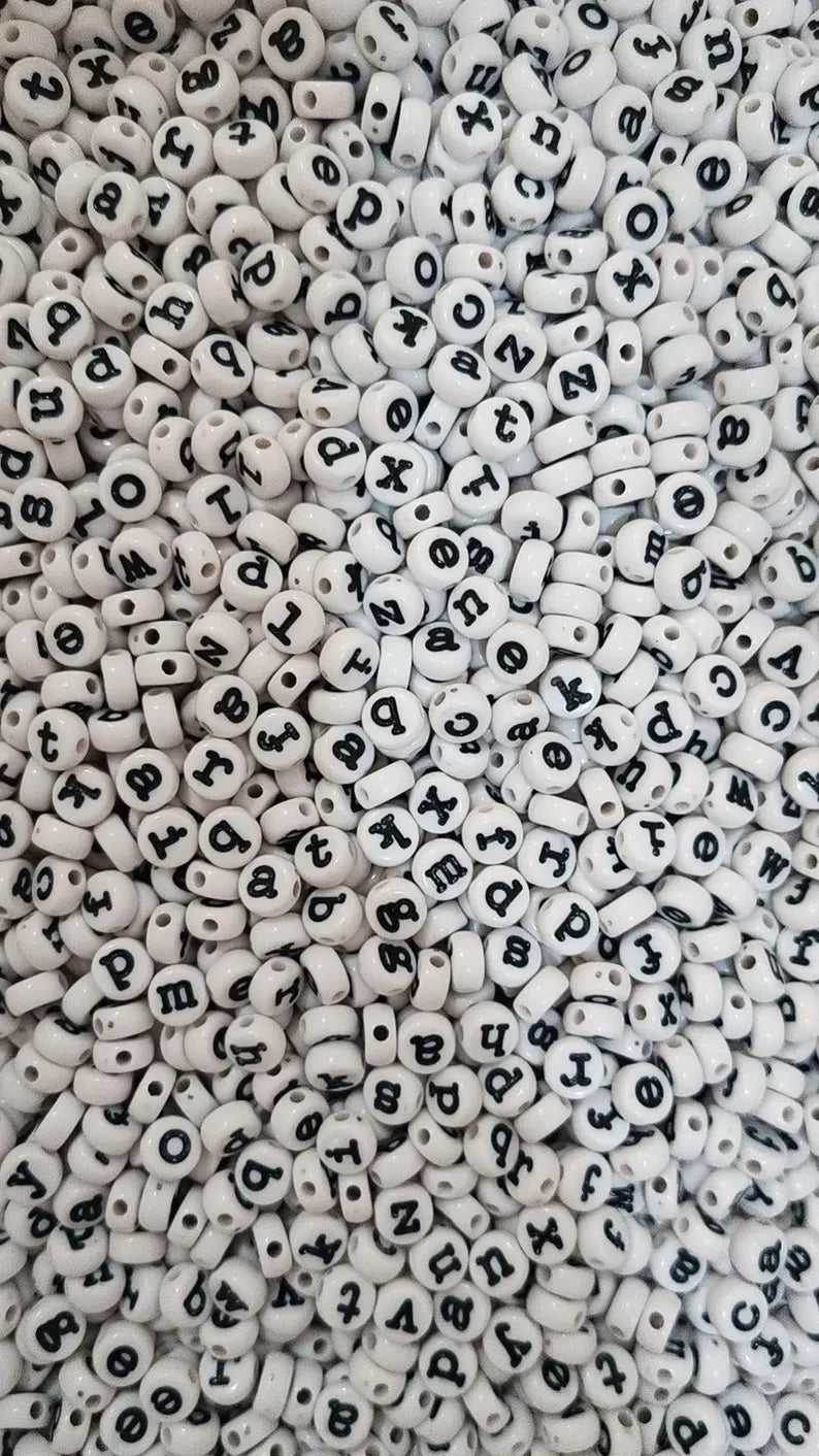 Lowercase typewriter font alphabet beads, 7mm, in a variety of colors, perfect for jewelry and craft projects.