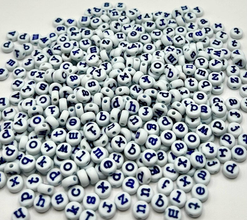 Light blue lowercase typewriter font alphabet beads with navy letters, 7mm size, ideal for jewelry making.