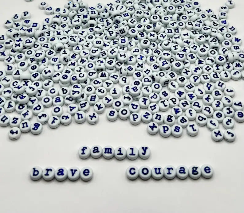 Light blue lowercase typewriter font alphabet beads with navy letters, 7mm for jewelry making, by Pretty Beans.