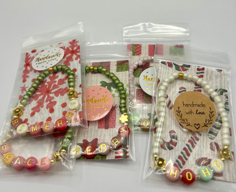 DIY holiday bracelet making kit by Pretty Beans with seed beads and lowercase alphabet charms for custom jewelry design.