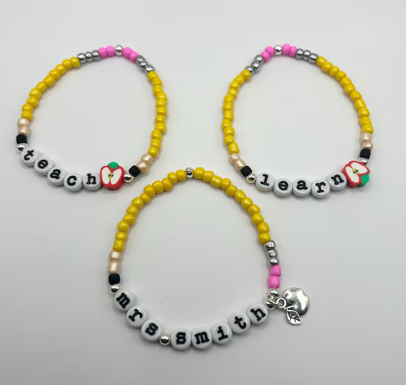DIY teacher bracelet making kit by Pretty Beans featuring seed beads, letter beads, and apple charms for creative jewelry crafting.