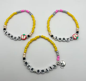 DIY teacher bracelet making kit by Pretty Beans featuring seed beads, letter beads, and apple charms for creative jewelry crafting.