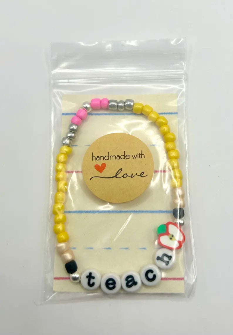 DIY teacher bracelet making kit by Pretty Beans featuring seed beads, letter beads, and apple charms for custom jewelry crafting.