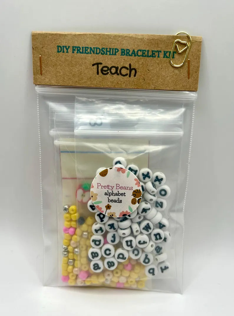 DIY teacher bracelet making kit by Pretty Beans featuring seed beads, letter beads, and apple charms for personalized jewelry craft.