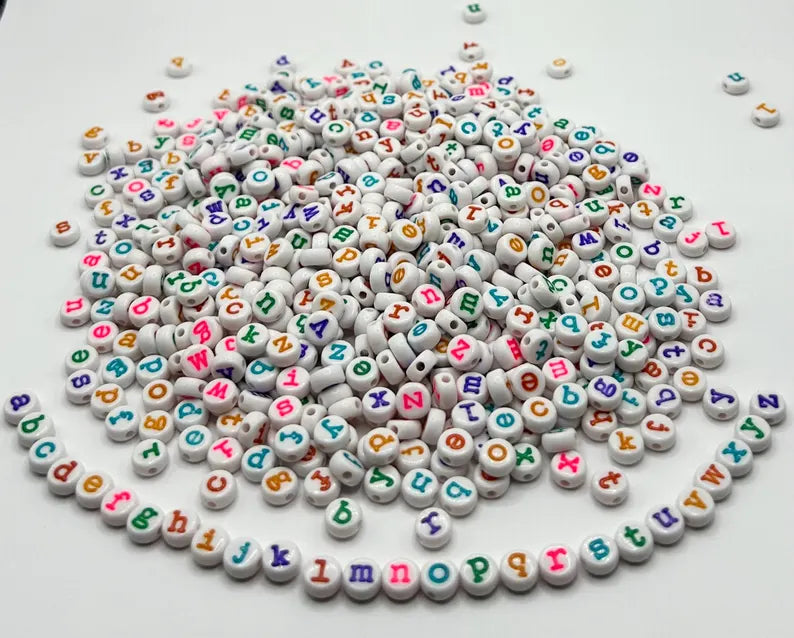 DIY teacher bracelet making kit by Pretty Beans with seed beads, letter beads, and apple charms for crafting jewelry.