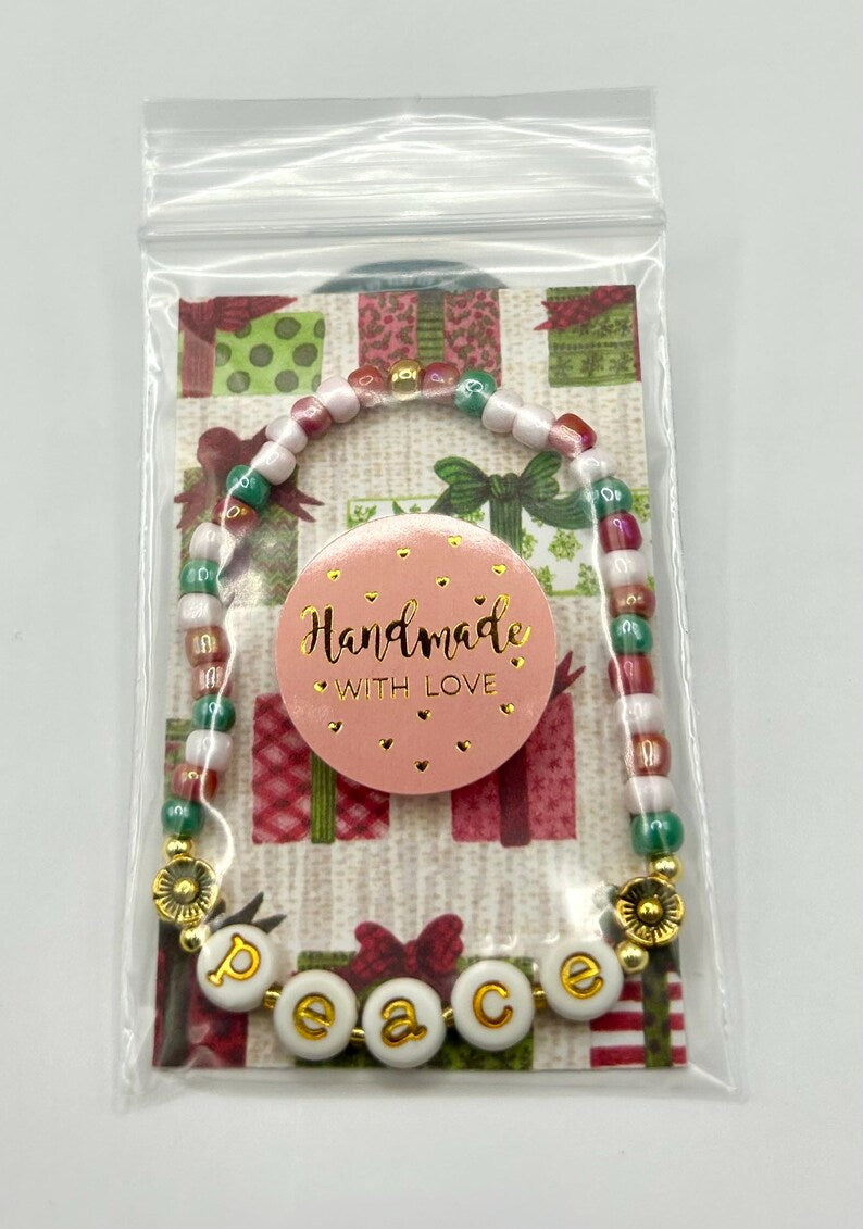 DIY holiday bracelet making kit by Pretty Beans with seed beads and lowercase alphabet charms for custom jewelry creation.