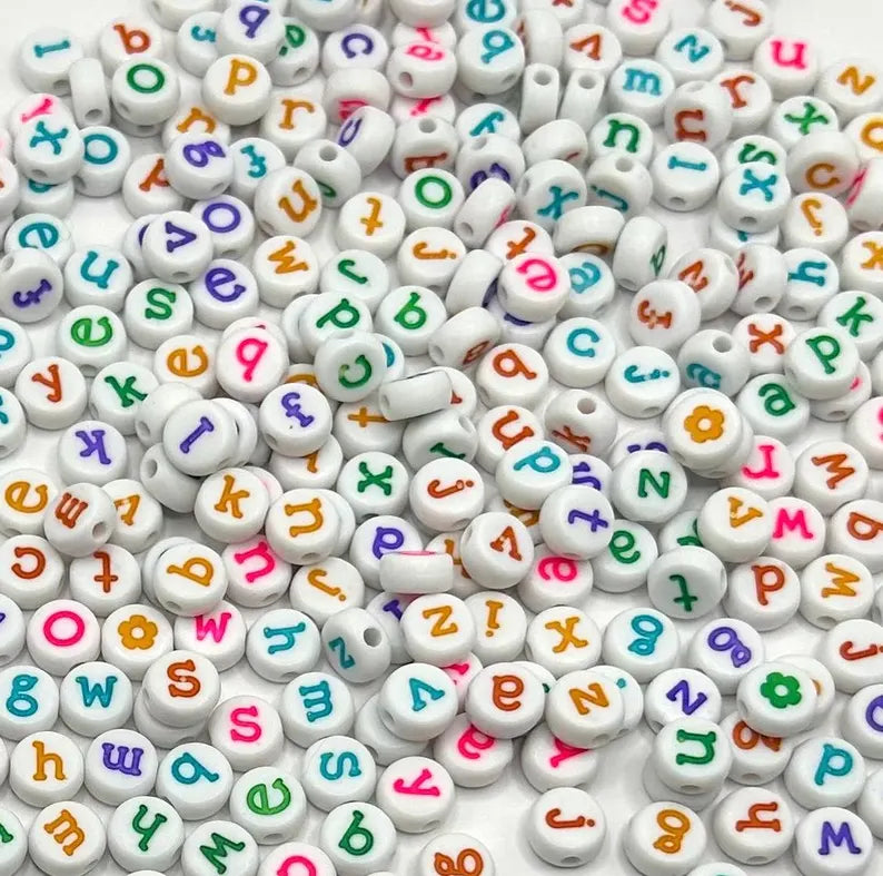 White lowercase alphabet beads with black letters, 7mm size, for jewelry making from Pretty Beans.