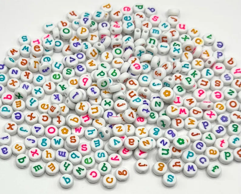 DIY teacher bracelet making kit by Pretty Beans featuring seed beads, letter beads, and apple charms for creative jewelry projects.