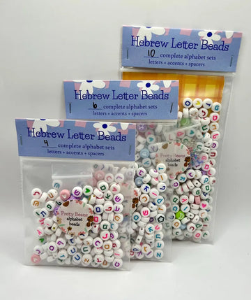 Colorful Hebrew alphabet letter beads, 7mm jewelry making supplies from Pretty Beans, shown in new packaging.