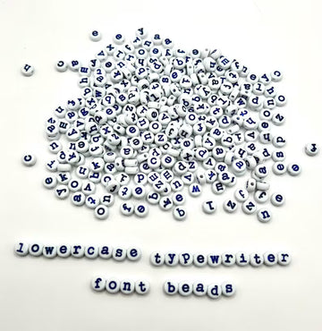 Light blue lowercase typewriter font alphabet beads with navy letters, 7mm, for jewelry making by Pretty Beans.