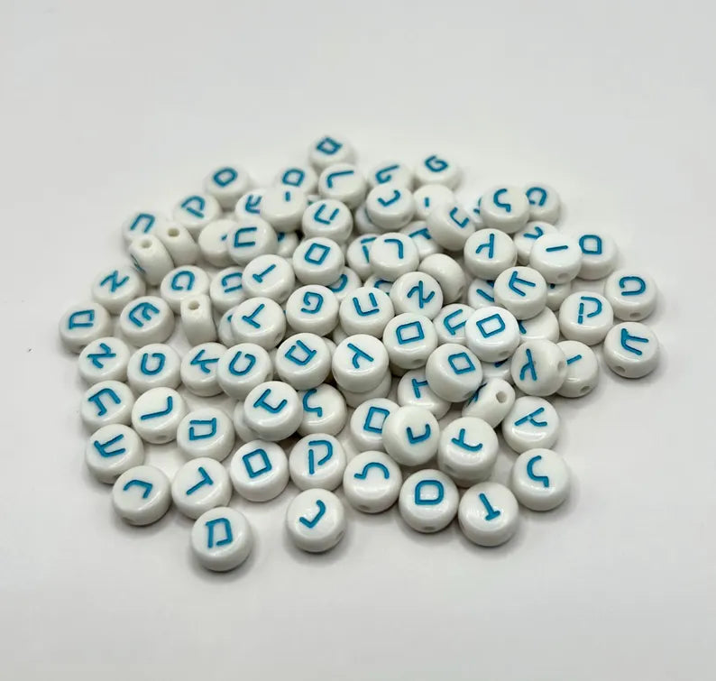 Light blue Hebrew alphabet beads with silver accents, ideal for DIY jewelry making, by Pretty Beans.