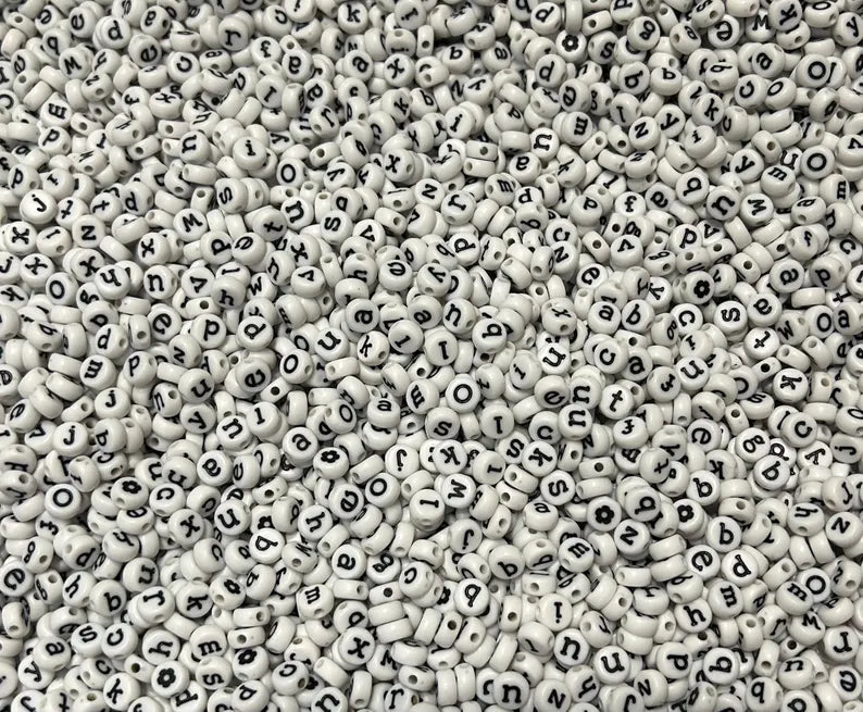 White lowercase alphabet beads with black letters, 7mm size, for jewelry making by Pretty Beans.