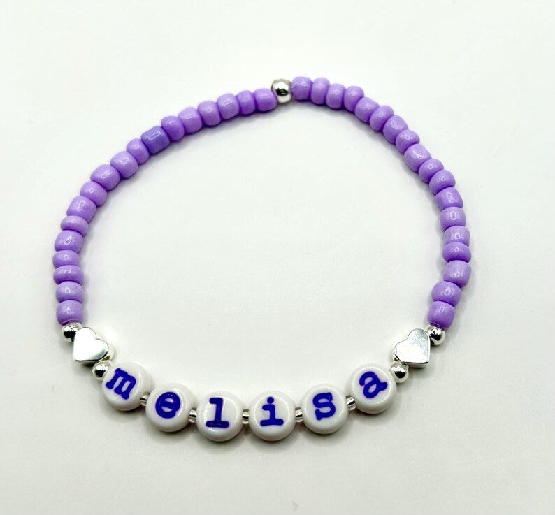 Purple alphabet beads featuring a typewriter font, 7mm size, set of 120 pieces, from Pretty Beans.