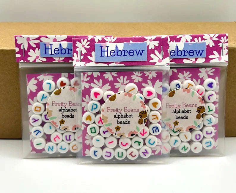 Colorful Hebrew alphabet letter beads, 7mm jewelry making supplies from Pretty Beans, shown in new packaging.